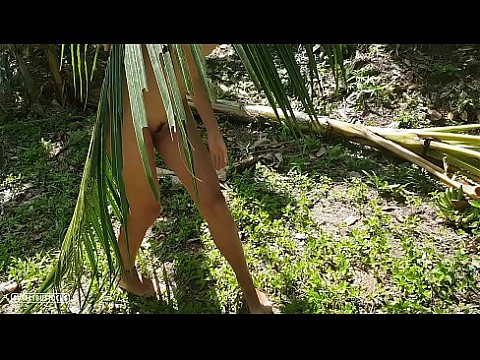 A naked girl is photographed in the wild jungle of the Amazon